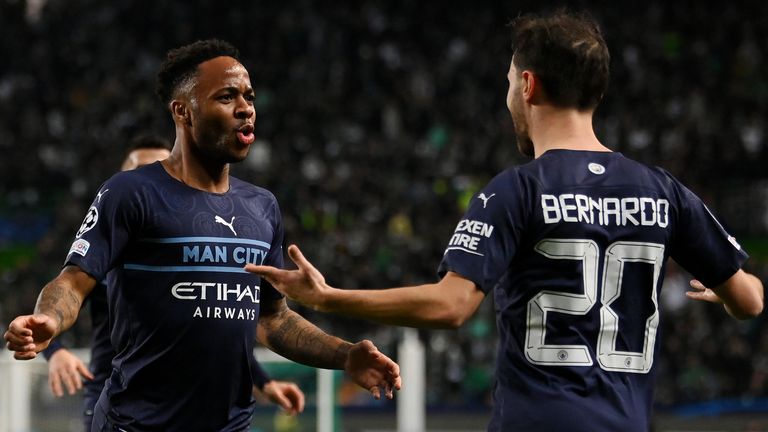 Raheem Sterling celebrates with Bernardo Silva after scoring Man City&#39;s fifth goal against Sporting Lisbon