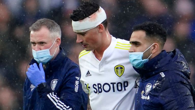 Leeds United&#39;s Robin Koch leaves the field with medics (AP)