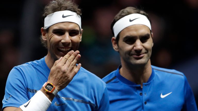 Europe's Roger Federer, right, and Rafael Nadal, left, smile during their Laver Cup doubles tennis match against World's Jack Sock and Sam Querrey in Prague, Czech Republic, Saturday, Sept. 23, 2017. (AP Photo/Petr David Josek)