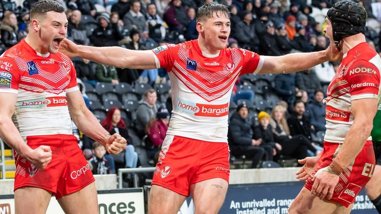 St Helens' Josh Simm (l) is congratulated on scoring a try against Hull FC