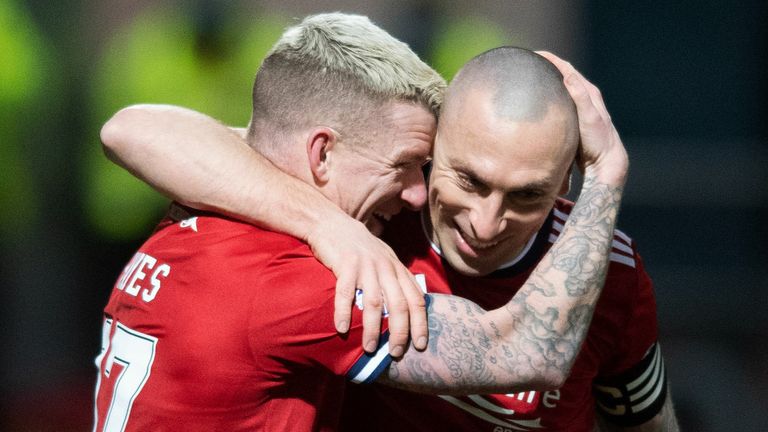 Johnny Hayes celebrates with Scott Brown after scoring