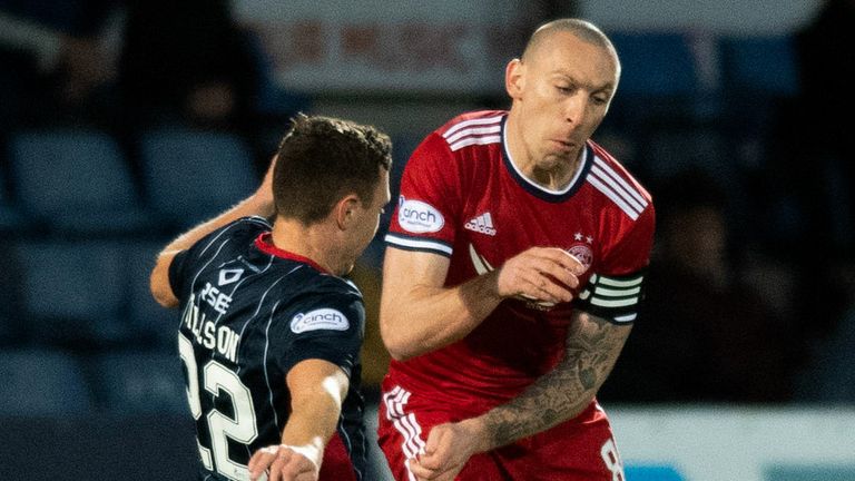 Ross County's Jordan Tillson tackles Scott Brown