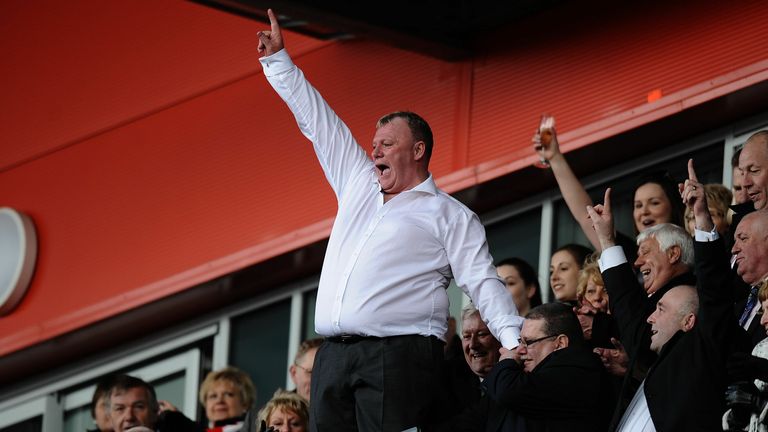 Rotherham Utd&#39;s  manager Steve Evans celebrates in the stand as his team are promoted during the npower League Two match at the New York Stadium