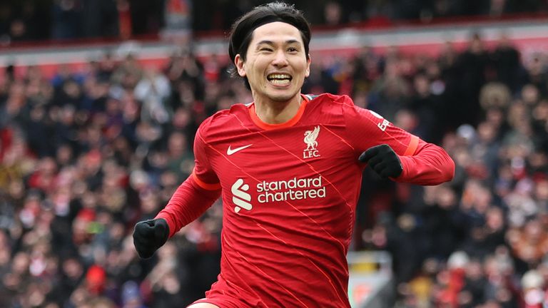 Takumi Minamino celebrates after he doubles Liverpool's lead over Cardiff
