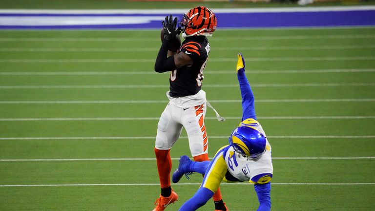 Cincinnati Bengals wide receiver Tee Higgins makes the catch against Los Angeles Rams cornerback Jalen Ramsey during the second half of the NFL Super Bowl 56