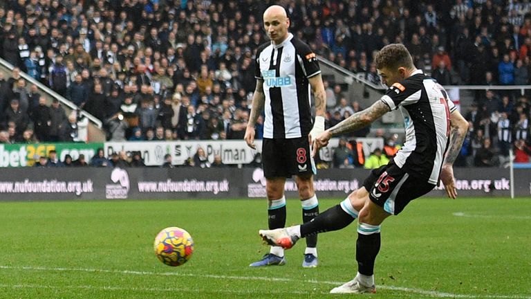 Newcastle United's English defender Kieran Trippier (R) scores the opening goal from this freekick during the English Premier League football match between Newcastle United and Aston Villa at St James' Park in Newcastle-upon-Tyne, north east England on February 13, 2022. 