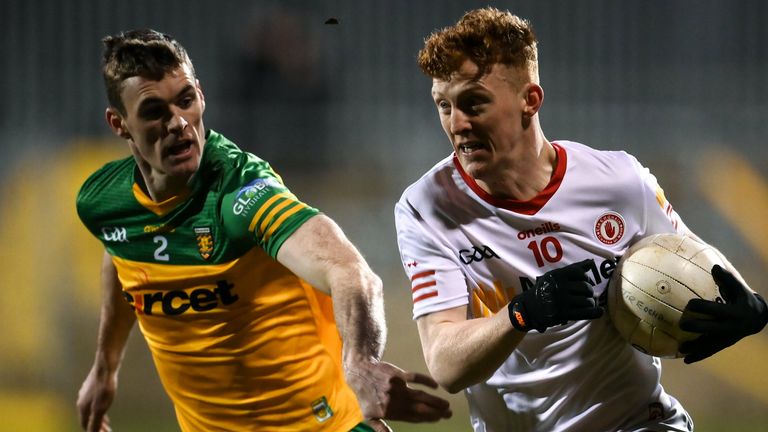 Nathan Donnelly of Tyrone in action against Caolan Ward of Donegal