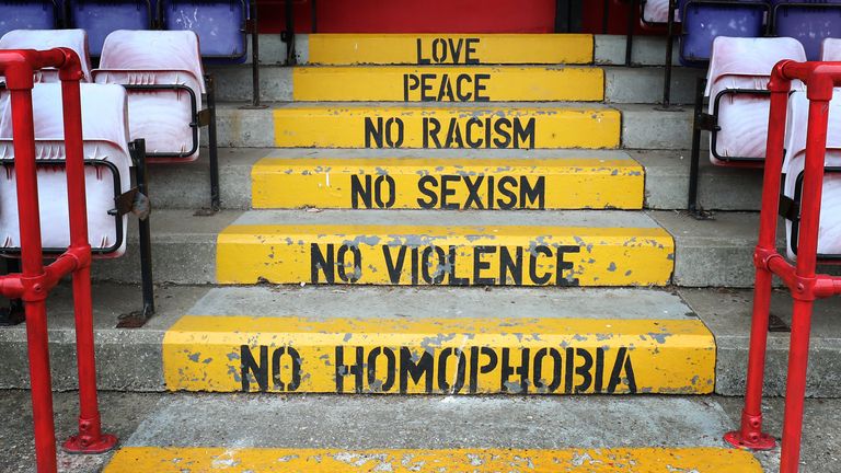 The terrace steps at non-league Whitehawk FC's TerraPura Ground in Brighton bear a clear anti-discrimination message