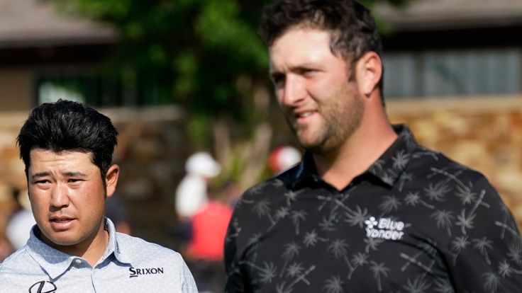 Sung Kang, left, greets Hideki Matsuyama, center, and Jon Rahm, right, after the trio played the 18th green during the first round of the AT&T Byron Nelson golf tournament in McKinney, Texas, Thursday, May 13, 2021. (AP Photo/Tony Gutierrez)