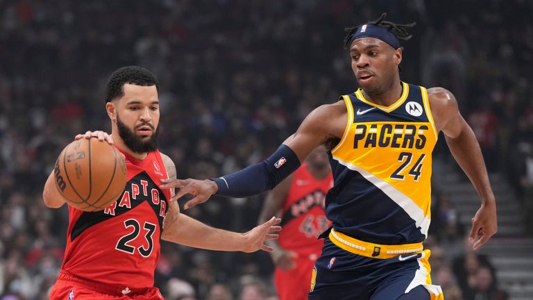 Toronto Raptors guard Fred VanVleet (23) is defended by Indiana Pacers guard Buddy Hield (24) during the first half of an NBA basketball game Saturday, March 26, 2022, in Toronto. (Frank Gunn/The Canadian Press via AP)