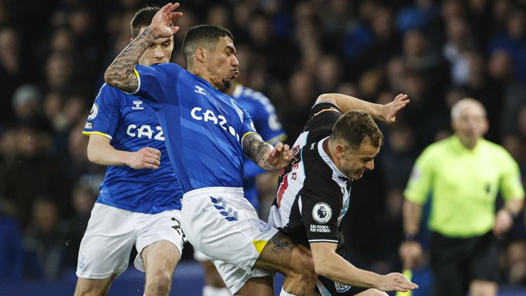 Allan and Ryan Fraser battle for the ball