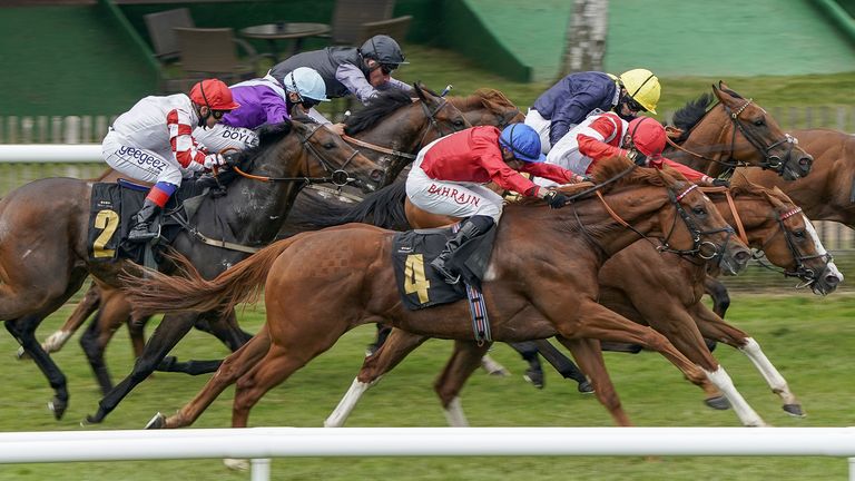 Tom Marquand riding Ametist (red/blue cap) wins The Join The Great Racing Welfare Cycle Handicap at Newmarket 