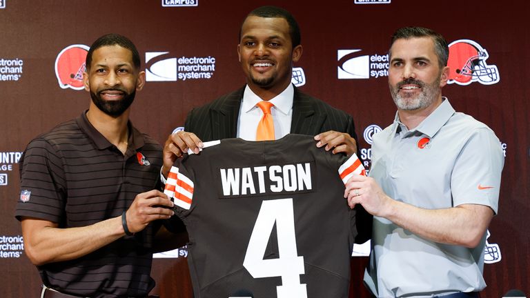 Cleveland Browns general manager Andrew Berry, new quarterback Deshaun Watson and head coach Kevin Stefanski pose for a photo during a news conference at the NFL football team's training facility, Friday, March 25, 2022, in Berea, Ohio. (AP Photo/Ron Schwane)