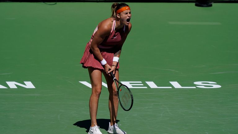 Aryna Sabalenka, of Belarus, reacts after a shot to Jasmine Paolini, of Italy, at the BNP Paribas Open tennis tournament Saturday, March 12, 2022, in Indian Wells, Calif. (AP Photo/Marcio Jose Sanchez)