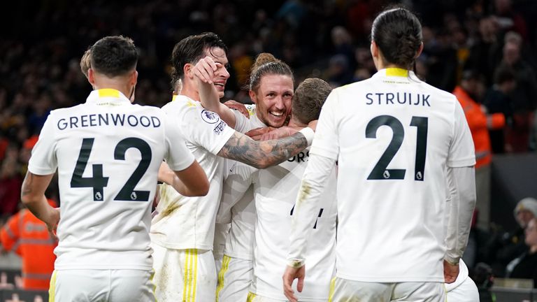 Luke Ayling is mobbed by team-mates after his winner at Wolves