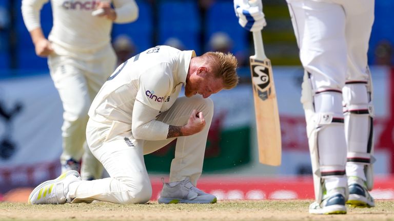 England's Ben Stokes celebrates taking the wicket of West Indies' Jason Holder during day three of their first cricket Test match at the Sir Vivian Richards Cricket Ground in North Sound, Antigua and Barbuda, Thursday, March 10, 2022. (AP Photo/Ricardo Mazalan)