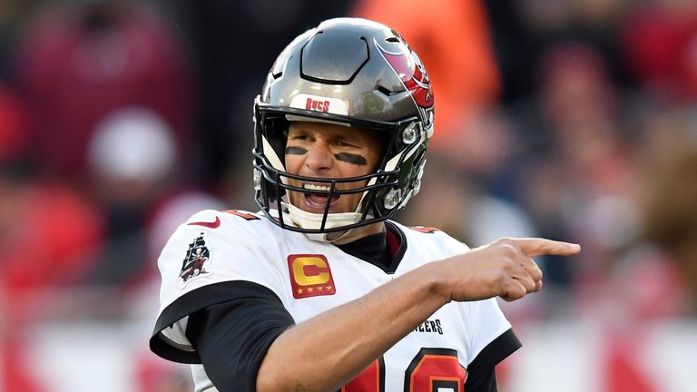 Tampa Bay Buccaneers quarterback Tom Brady (12) calls a play against the Los Angeles Rams during the second half of an NFL divisional round playoff football game Sunday, Jan. 23, 2022, in Tampa, Fla. (AP Photo/Jason Behnken)