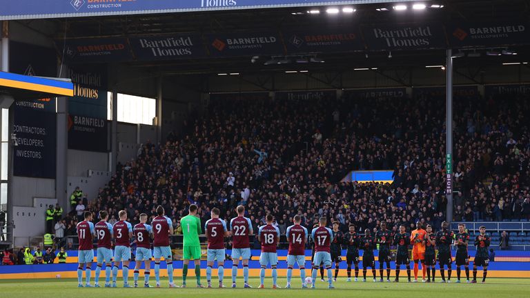 Players observe a minute&#39;s applause at Burnley