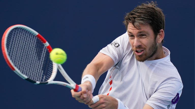 Cameron Norrie returns a shot from Jack Draper, both of Great Britain, during the Miami Open tennis tournament, Friday, March 25, 2022, in Miami Gardens, Fla. (AP Photo/Wilfredo Lee)