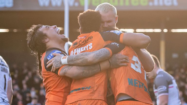 Picture by Allan McKenzie/SWpix.com - 06/03/2022 - Rugby League - Betfred Super League Round 4 - Castleford Tigers v Hull FC - the Mend A Hose Jungle, Castleford, England - Castleford's Mahe Fonua (l) celebrates Gareth O'Brien's try against Hull FC.