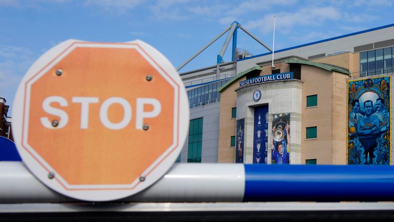 A barrier at an entrance to Chelsea football club's Stamford Bridge stadium in London, Thursday, March 10, 2022. Unprecedented restrictions have been placed on Chelsea’s ability to operate by the British government after owner Roman Abramovich is targeted in sanctions. Abramovich is among seven wealthy Russians who had their assets frozen by the government. (AP Photo/Kirsty Wigglesworth)