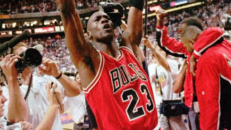 Michael Jordan celebrates after the Chicago Bulls beat the Phoenix Suns to complete the first three-peat in the summer of 1993