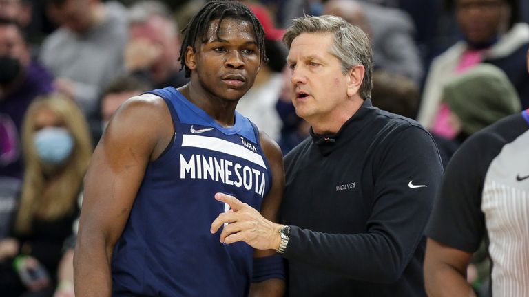 Minnesota Timberwolves head coach Chris Finch and Anthony Edwards chat on the sideline