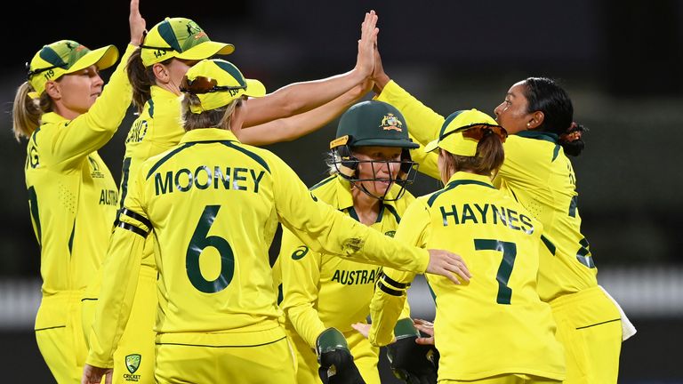 Australian players celebrate the wicket of England&#39;s Amy Jones during the ICC Women&#39;s Cricket World Cup 2022 cricket match between England and Australia at Seddon Park in Hamilton, New Zealand, Saturday, March. 5, 2022.