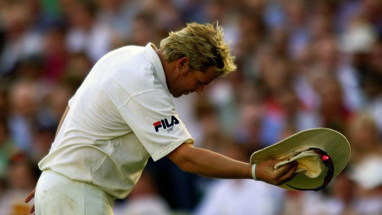 Australia's Shane Warne bows to spectators.