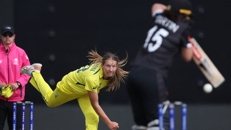 Australia's Darcie Brown (L) bowls to New Zealand's Katey Martin (R) during the 2022 Women's Cricket World Cup 