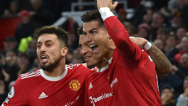 Cristiano Ronaldo celebrates after restoring Manchester United&#39;s lead against Tottenham