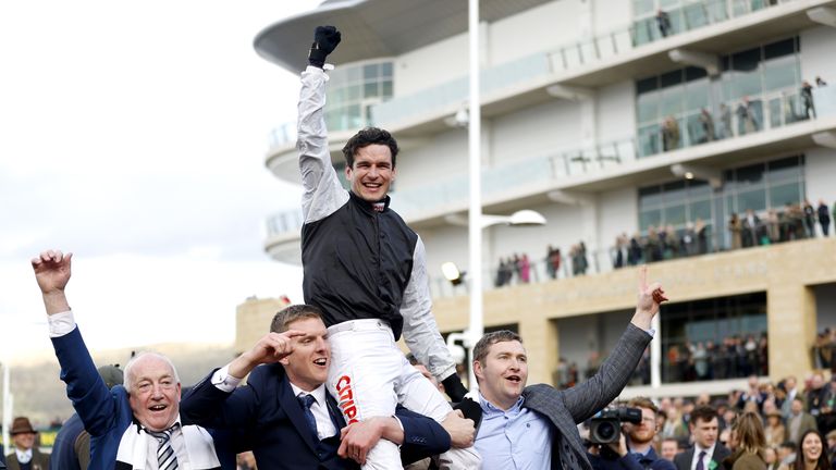 Danny Mullins is lifted around the Cheltenham parade ring by Flooring Porter's owners after winning the Stayers' Hurdle
