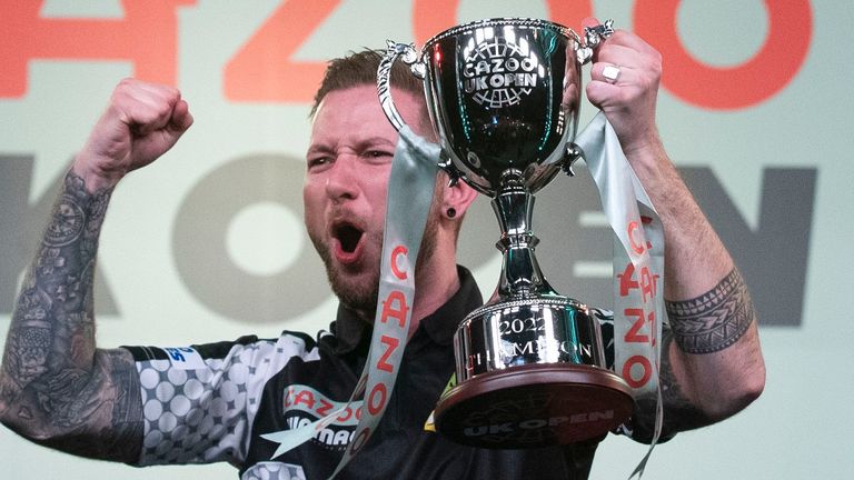 Danny Noppert lifts the UK Open trophy after defeating Michael Smith in the final
