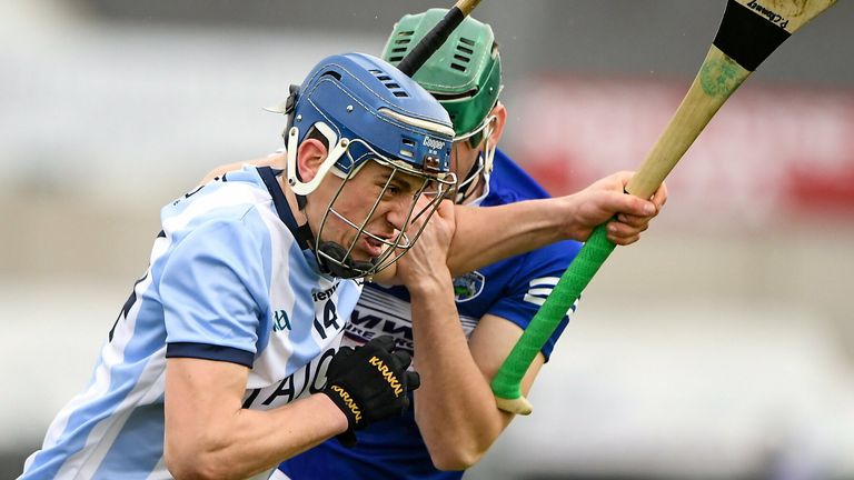 Paul Crummey of Dublin in action against Sean Downey of Laois