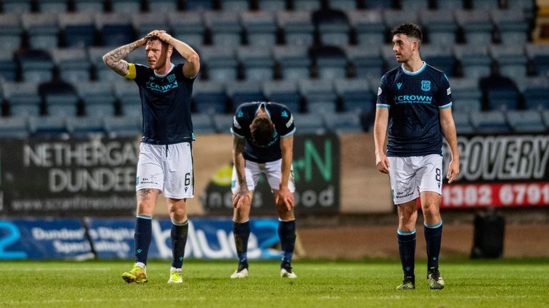 DUNDEE, SCOTLAND - MARCH 09: Dundee&#39;s players are left dejected at full time during a cinch Premiership match between Dundee and St Mirren at the Kilmac Stadium at Dens Park, on March 09, 2022, in Dundee, Scotland.  