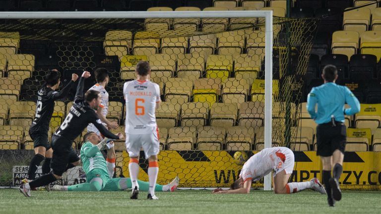 Dundee United's Ryan Edwards scores an own goal to make it 2-1 to Livingston