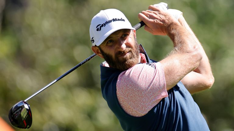 Dustin Johnson hits a drive during the weather delayed completion of the second round of THE PLAYERS Championship on the Stadium Course at TPC Sawgrass