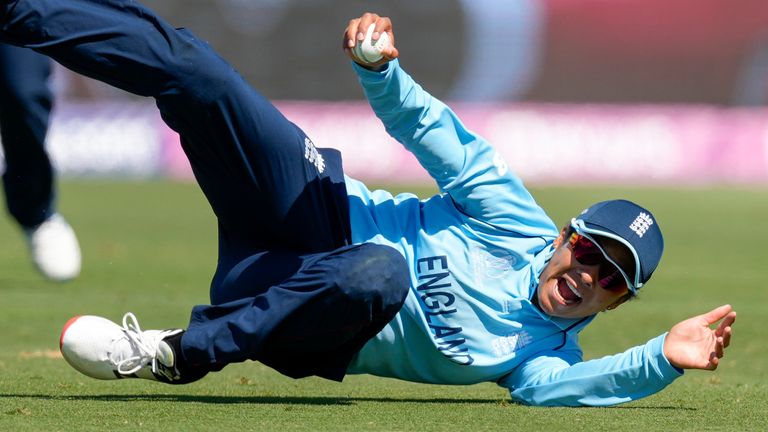 Sophia Dunkley-Brown of England celebrates taking a catch to dismiss Mithali Raj of India during the women&#39;s world cup cricket match between England and India at Bay Oval, Mt Maunganui, New Zealand, Wednesday, March 16, 2022. (John Cowpland/Photosport via AP)


