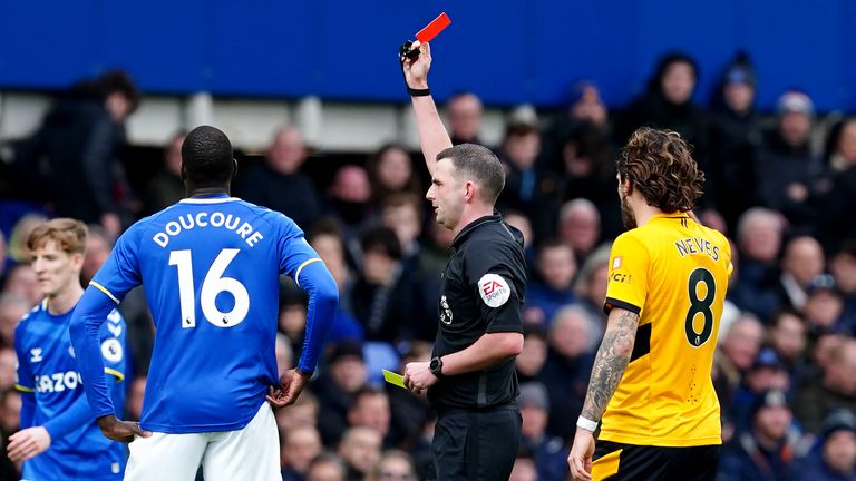 Referee Michael Oliver shows Jonjoe Kenny (not pictured) a red card