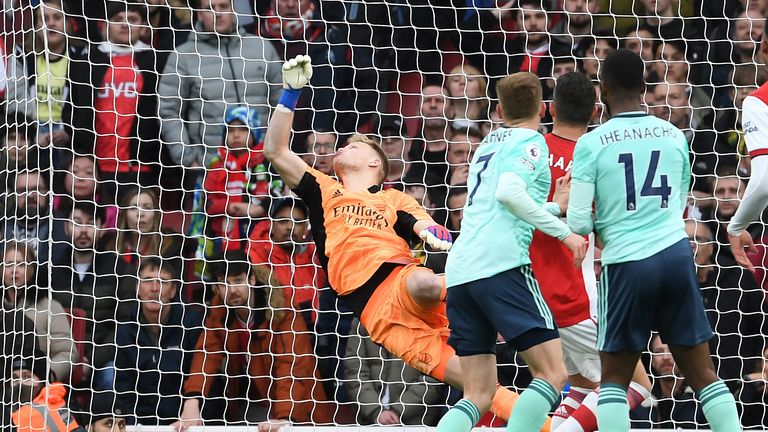 Arsenal goalkeeper Aaron Ramsdale saves from Leicester&#39;s Harvey Barnes during the Premier League match between Arsenal and Leicester City at Emirates Stadium on March 13, 2022 in London, England. 