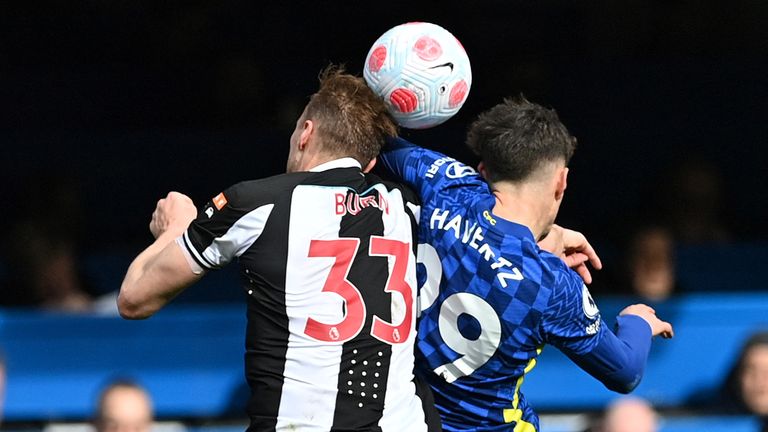 Newcastle United&#39;s English defender Dan Burn (L) vies in the air with Chelsea&#39;s German midfielder Kai Havertz during the English Premier League football match between Chelsea and Newcastle United at Stamford Bridge in London on March 13, 2022.
