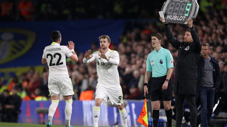 Patrick Bamford replaces Jack Harrison of Leeds United during the Premier League match between Leeds United and Aston Villa at Elland Road on March 10, 2022 in Leeds, England. 