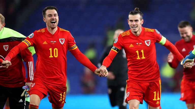 Wales&#39; Aaron Ramsey (left) and Gareth Bale (right) celebrate victory and qualification after the final whistle in the UEFA Euro 2020 Qualifying match at the Cardiff City Stadium. PA Photo. Picture date: Tuesday November 19, 2019. See PA story SOCCER Wales. Photo credit should read: Nick Potts/PA Wire