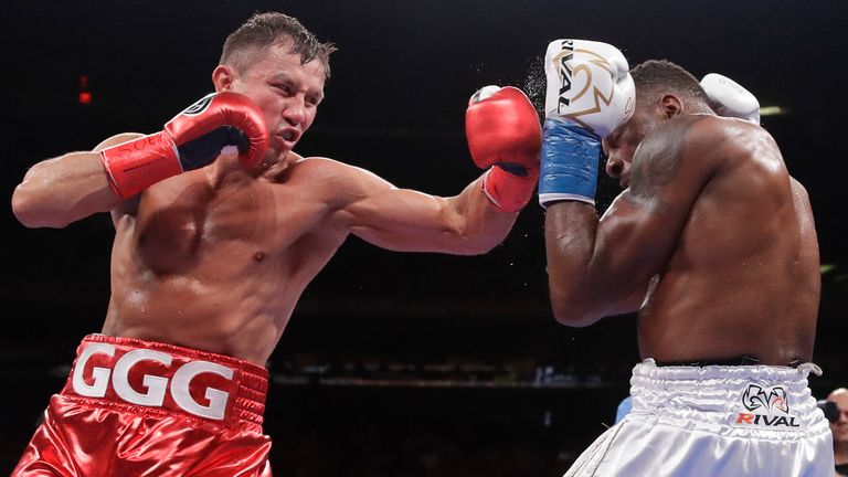 Kazakhstan...s Gennady Golovkin, left, punches Canada...s Steve Rolls during the fourth round of a super middleweight boxing match Saturday, June 8, 2019, in New York. Golovkin stopped Rolls in the fourth round. (AP Photo/Frank Franklin II)