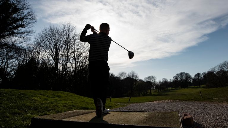 A golfer enjoys a round of at Allerton Manor golf course.
