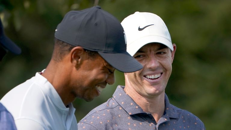 Rory McIlroy, right, looks at Tiger Woods and laughs during a practice round Wednesday, Aug. 26, 2020, for the BMW Championship golf tournament at the Olympia Fields Country Club in Olympia Fields, Ill. (AP Photo/Charles Rex Arbogast)


