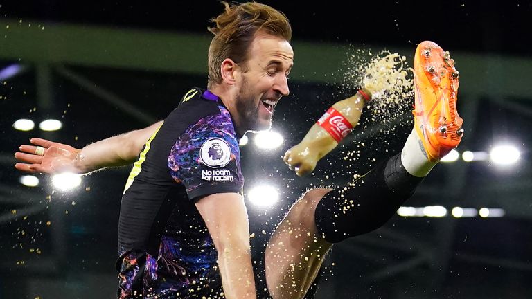 Harry Kane volleys a Coke bottle after scoring Spurs' second goal