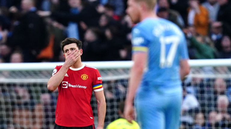 Harry Maguire reacts after Kevin De Bruyne scores Man City's second goal