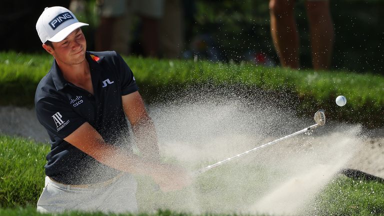  Viktor Hovland of Norway holes his shot from the bunker for eagle on the sixth hole during the third round of the Arnold Palmer Invitational