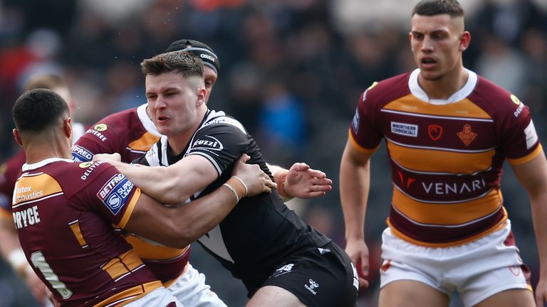  Hull FC's Connor Wynne and Huddersfield Giants' Will Pryce in action during the Betfred Super League match at the MKM Stadium, Kingston upon Hull. Picture date: Sunday March 20, 2022.